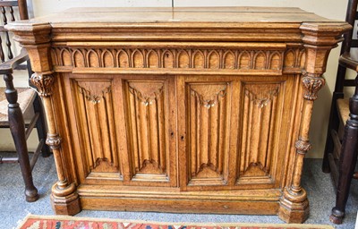 Lot 187 - A Victorian Carved Oak Library Cupboard, in...