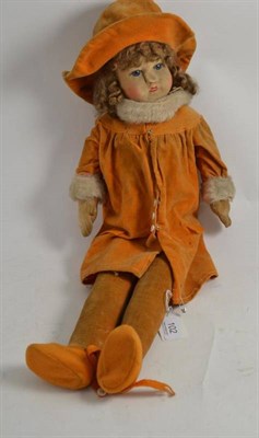 Lot 102 - Circa 1930's Chad Valley Fabric doll wearing an orange velvet coat, matching hat and felt shoes
