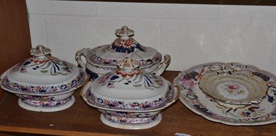 Lot 109 - A large ironstone meat plate, three tureens and a painted porcelain dish