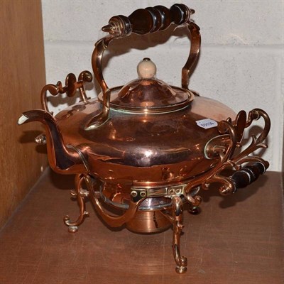 Lot 115 - A late Victorian copper kettle on stand complete with burner, the stand with scrolling framework