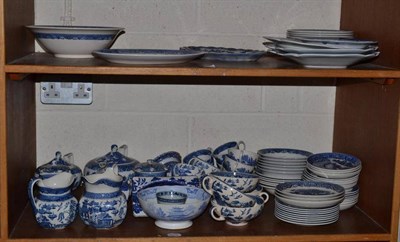 Lot 116 - A collection of assorted blue and white willow pattern ceramics including Wedgwood on two shelves