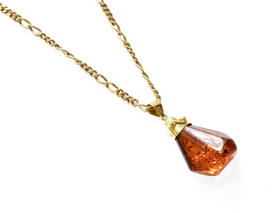 Lot 319 - An Amber Pendant on Chain, the irregular...