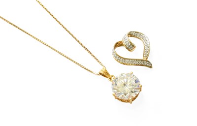 Lot 484 - A 9 Carat Gold Diamond Heart Pendant, length 2....