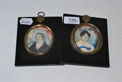 Lot 129 - Two early 19th century portrait miniatures of Maria and R Dickinson in ebonised frames