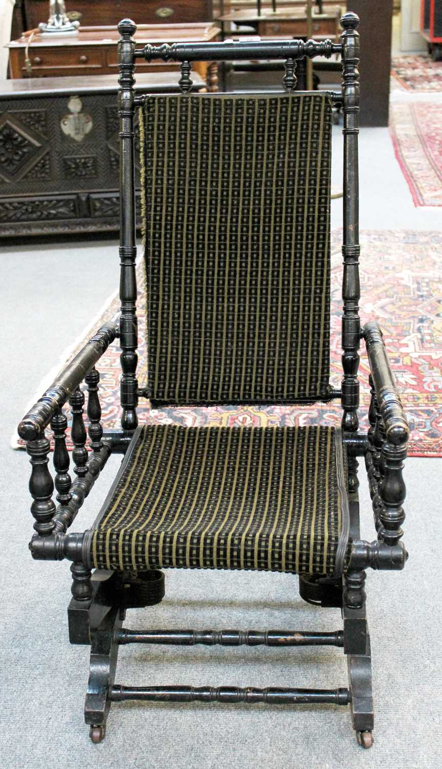 Lot 46 - A 19th Century Ebonised American Style Rocking...