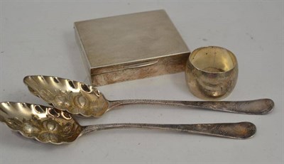 Lot 130 - Two silver berry spoons, silver napkin ring and a silver mounted cigarette box