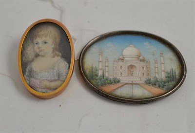 Lot 135 - An oval miniature of a child on ivory (a.f.) and an oval miniature of the Taj Mahal (2)