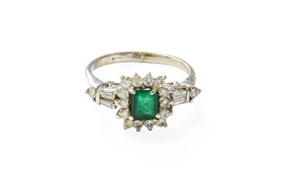 Lot 385 - An Emerald and Diamond Cluster Ring, the...