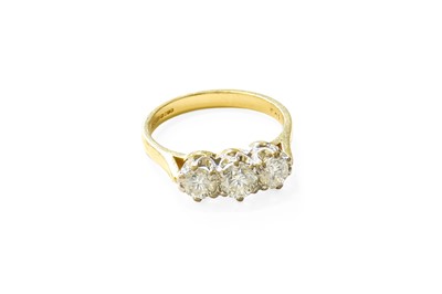 Lot 386 - An 18 Carat Gold Diamond Three Stone Ring, the...