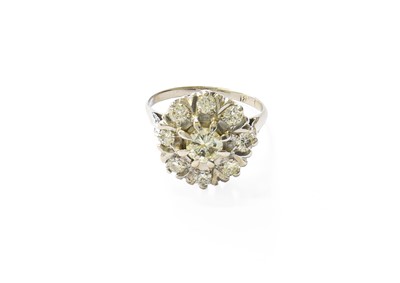 Lot 382 - A Diamond Cluster Ring, the central raised...