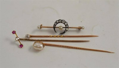 Lot 142 - A diamond stick pin, two others and a crescent brooch (4)