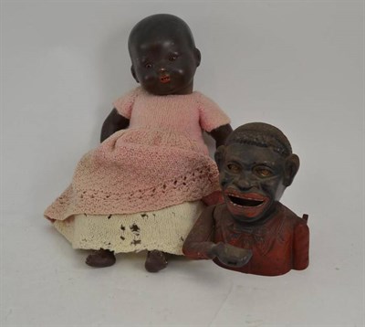 Lot 152 - A Jolly Nigger money bank and an Armand Marseille doll AM351/3 1/2K