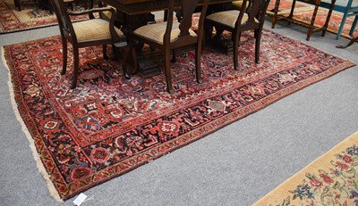 Lot 1035 - Heriz Carpet, the brick red field of angular...