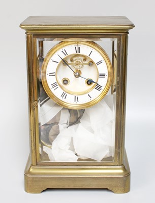 Lot 1303 - A French Brass Four Glass Clock by Richard &...