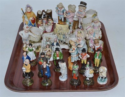 Lot 163 - A tray of nine vesta/spill holders and sixteen porcelain figures, including Conta & Boehme