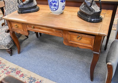 Lot 1240 - A French Walnut Bureau Plat, with cleated...