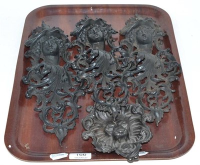 Lot 166 - Three cast iron wall pockets and a lions head dish