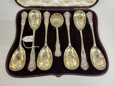 Lot 2208 - A Cased Set of Six Victorian Parcel-Gilt Silver Berry-Spoons and a Sifting Spoon