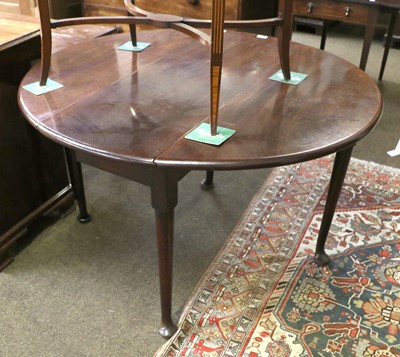 Lot 1331 - A George III Mahogany Oval Dropleaf Table, on...