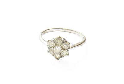 Lot 439 - A Diamond Cluster Ring, the central raised...