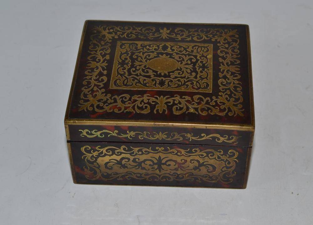 Lot 198 - A late 19th century tortoiseshell cigarette box with brass inlay, 7cm high