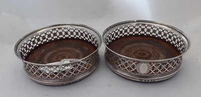 Lot 2018 - A Pair of George III Silver Wine-Coasters