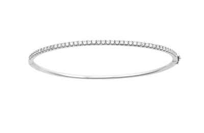 Lot 2282 - An 18 Carat White Gold Diamond Bangle, by...