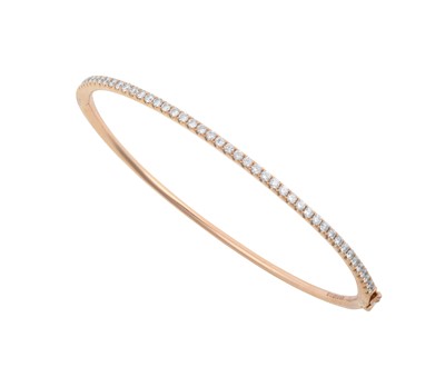 Lot 2272 - An 18 Carat Rose Gold Diamond Bangle, by Hirsh...