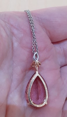 Lot 2271 - A Pink Tourmaline and Diamond Pendant on Chain...