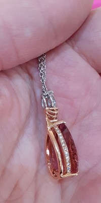 Lot 2271 - A Pink Tourmaline and Diamond Pendant on Chain...