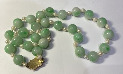 Lot 469 - A Jade Bead and Cultured Pearl Necklace,...