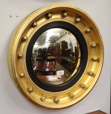 Lot 1402 - A Regency Gilt Framed Convex Mirror, with...