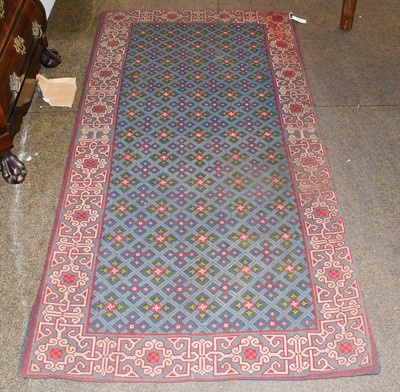 Lot 1020 - Needlepoint Rug, the diamond lattice field of...