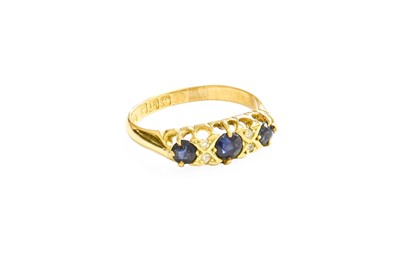 Lot 335 - An 18 Carat Gold Sapphire and Diamond Ring,...