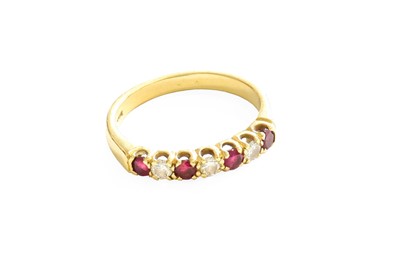 Lot 390 - An 18 Carat Gold Ruby and Diamond Half Hoop...