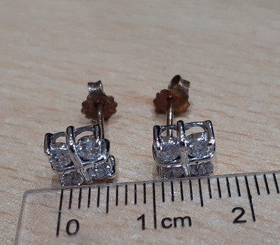 Lot 2059 - A Pair of Diamond Cluster Earrings four round...