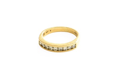 Lot 396 - A Diamond Half Hoop Ring, nine round brilliant...