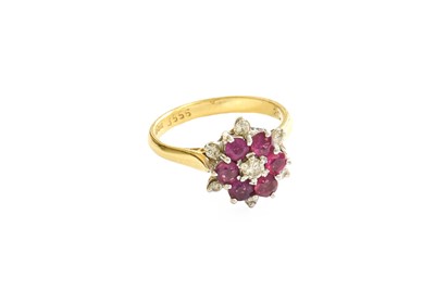 Lot 375 - An 18 Carat Gold Ruby and Diamond Cluster Ring,...