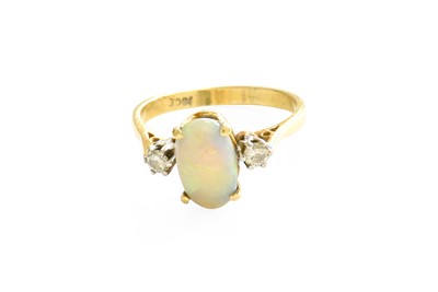 Lot 388 - An Opal and Diamond Three Stone Ring, the oval...