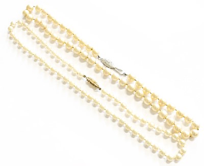 Lot 411 - A Single Row Cultured Pearl Necklace, knotted...