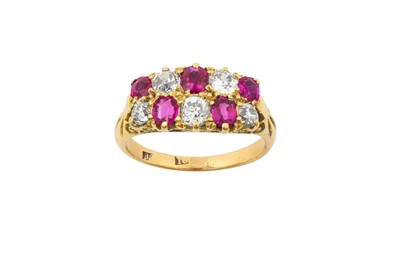 Lot 2295 - A Ruby and Diamond Ring two rows comprising of...