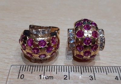 Lot 2040 - A Pair of Ruby and Diamond Cuff Earrings three...