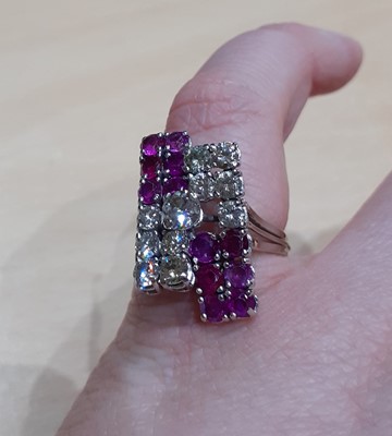 Lot 2042 - A Ruby and Diamond Cluster Ring a raised round...