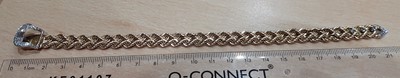 Lot 2121 - A Diamond Buckle Bracelet two rows of yellow...