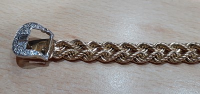 Lot 2121 - A Diamond Buckle Bracelet two rows of yellow...