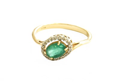 Lot 44 - A 9 Carat Gold Emerald and Diamond Cluster...