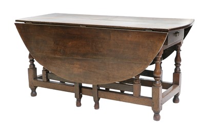 Lot 234 - A Joined Oak Six-to-Eight-Seater Dropleaf...