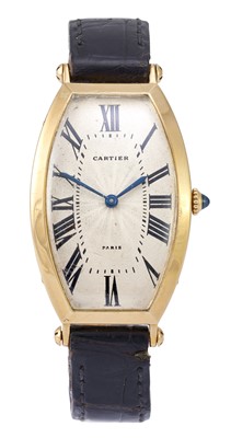 Lot 2186 - Cartier: A Rare Tonneau Shaped 18 Carat Gold...