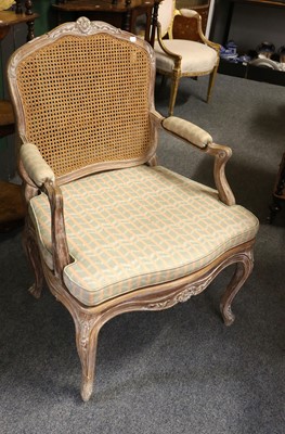 Lot 1258 - A French Carved Walnut Fauteuil, with ''limed''...