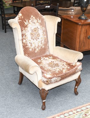 Lot 1174 - A Wing Back Chair